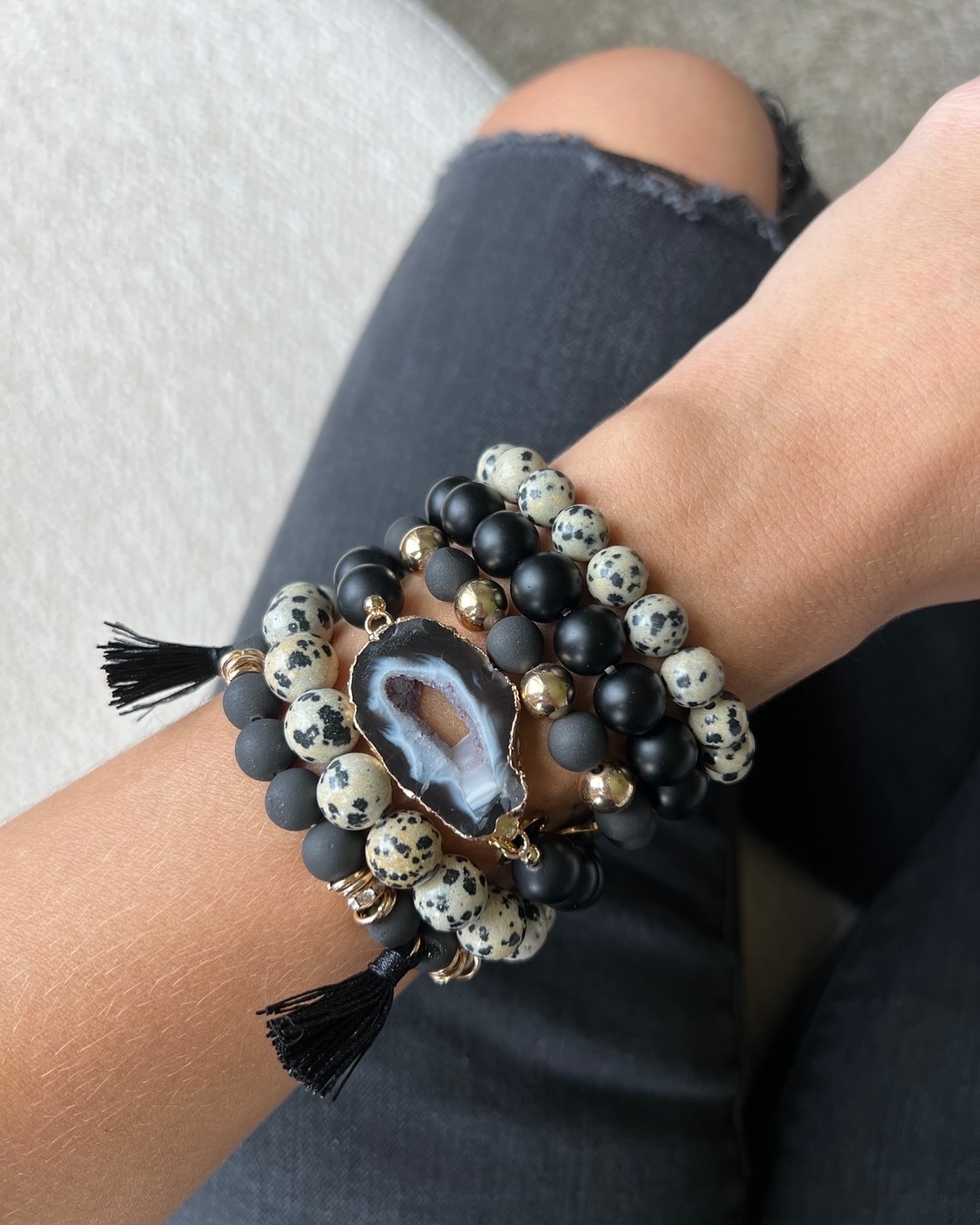 Stunning black geode/Dalmatian beads accented with gold leaf fashion cuff